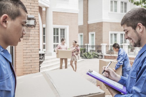Removal team planning a move in a French city apartment