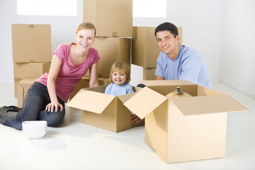 Moving team handling a home relocation in a French residential street