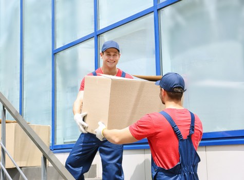 Professional movers handling a household relocation in a French city