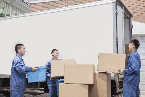 Removal team planning a house move in a French city apartment area