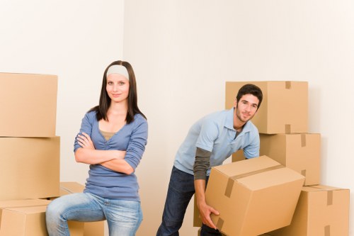 Packed moving boxes and furniture ready for removals in France