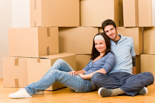 Commercial movers handling furniture and equipment in a French business district
