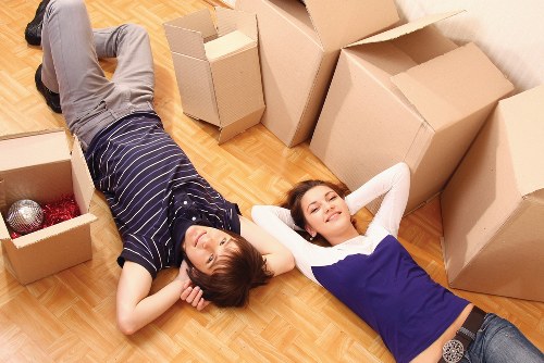 Moving crew handling boxed items with care during transport