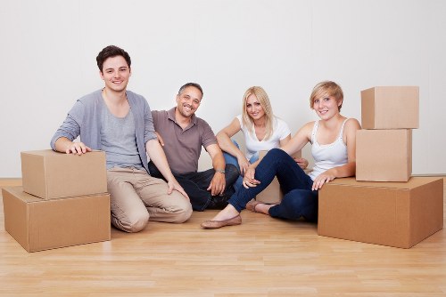 House movers organizing boxes and furniture for delivery in France