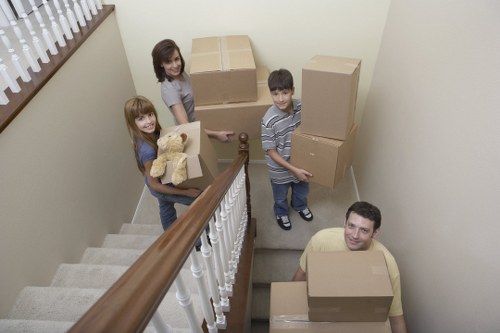 Local movers preparing furniture for transport on moving day in France