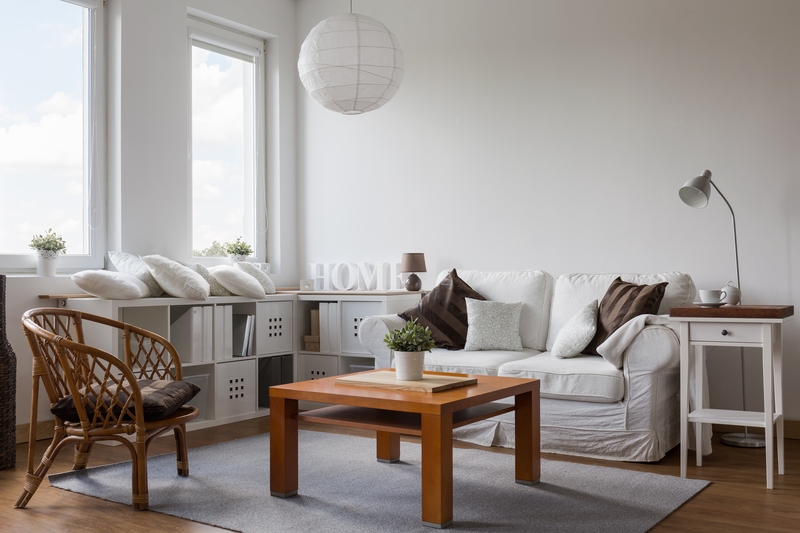 A moving team transporting furniture through an apartment building in France
